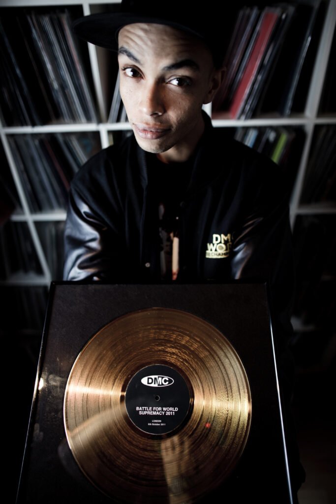 DMC World Champion Nelson Scratch from Hug Bookings holding his gold record